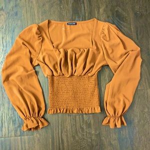 Women’s blouse in size S. Rust/Orange color.